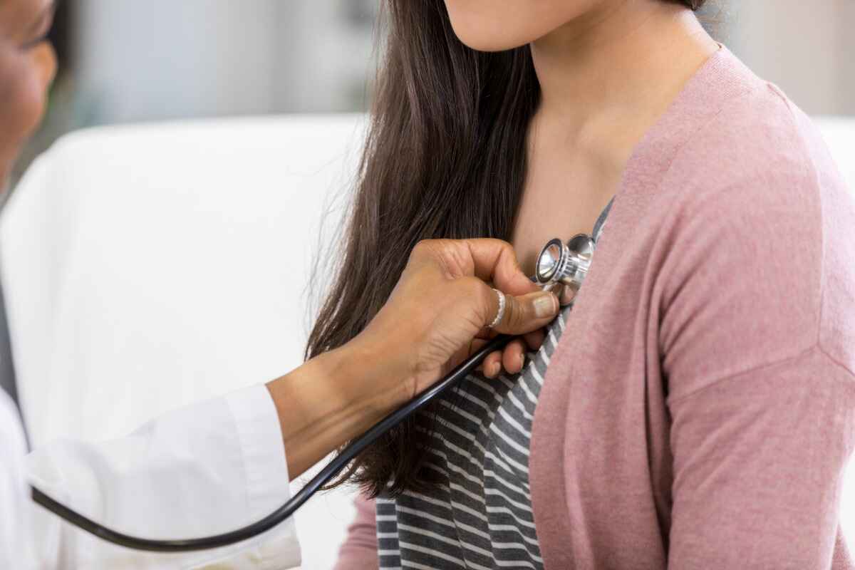 Doctor listens for a heart murmur