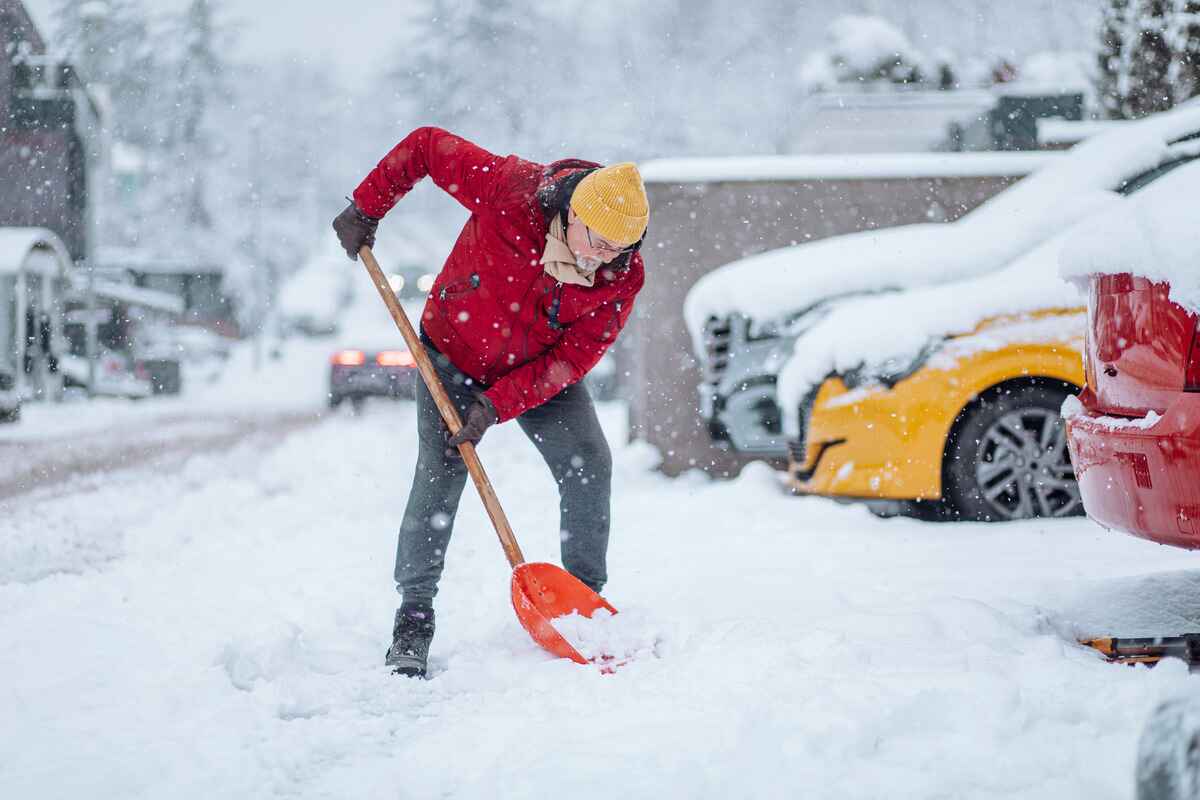 Man shoveling snow in the cold