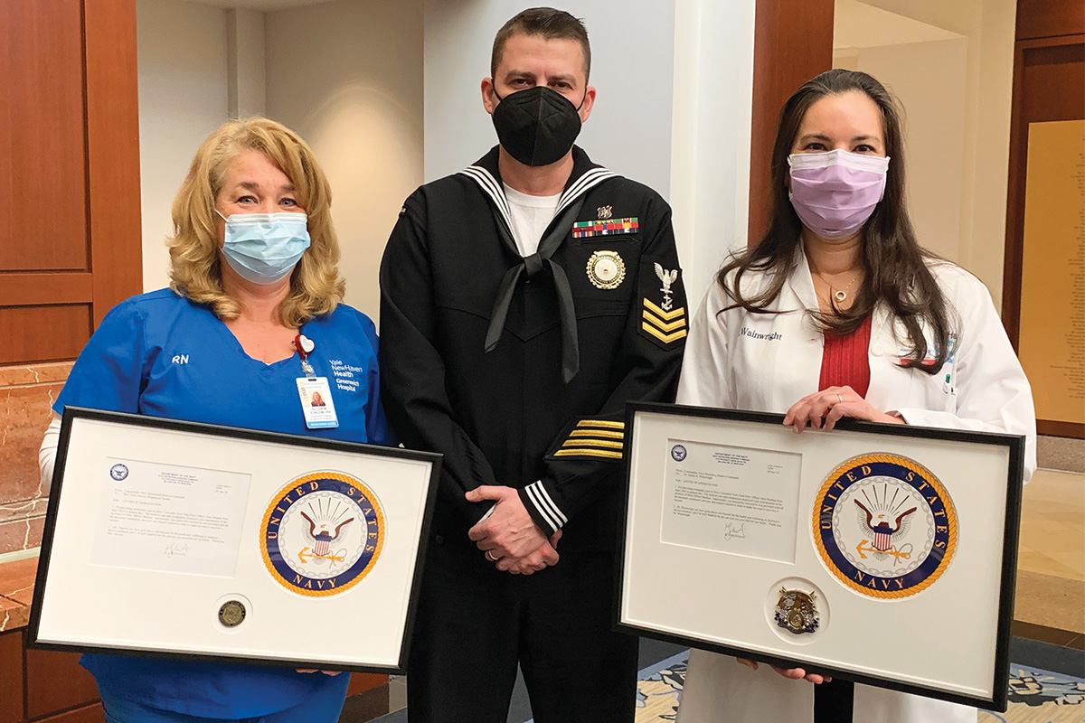 U.S. Navy recruiter John Meehan (center), Sandra Wainwright, MD, (right), and Ellen Stacom, RN (left)