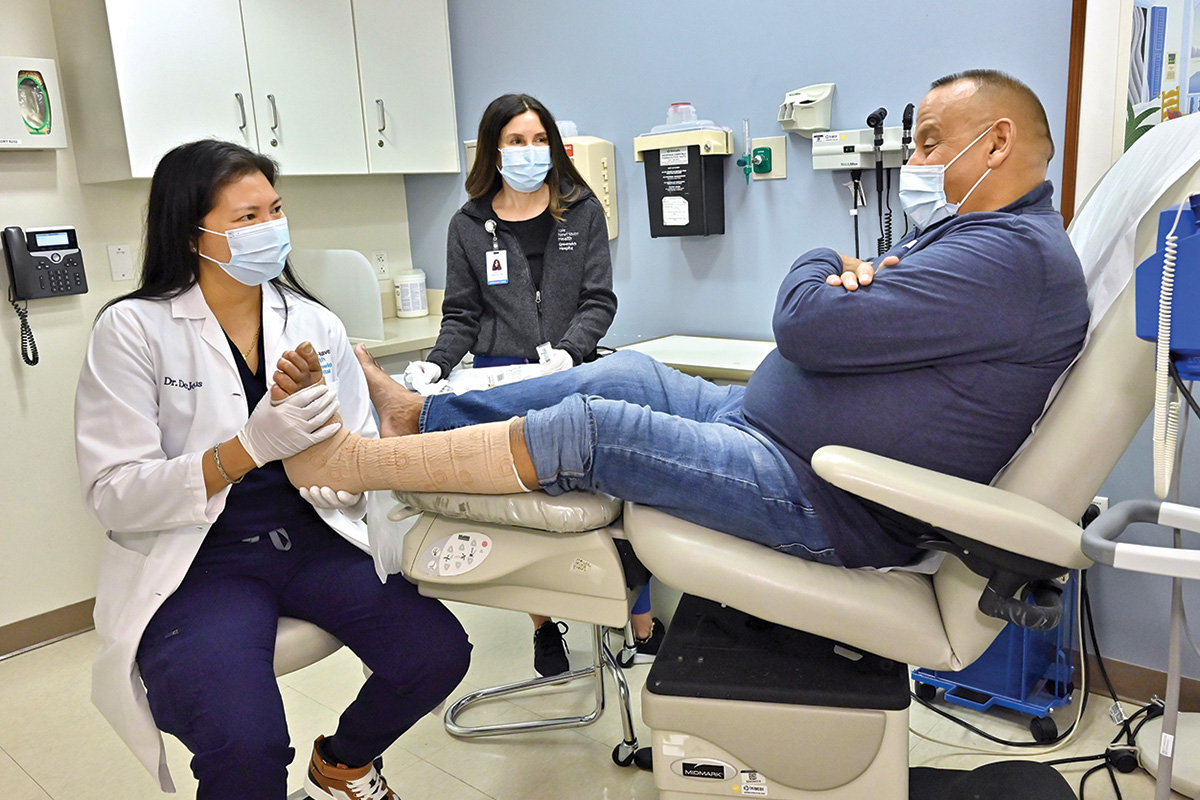 Lady Paula DeJesus, DMP, a surgical podiatrist, Patrick Bria, and Sally O'Brien, RN