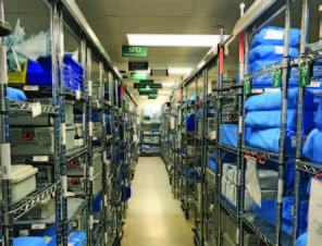 Shelves are stocked with sterilized trays and individual instruments